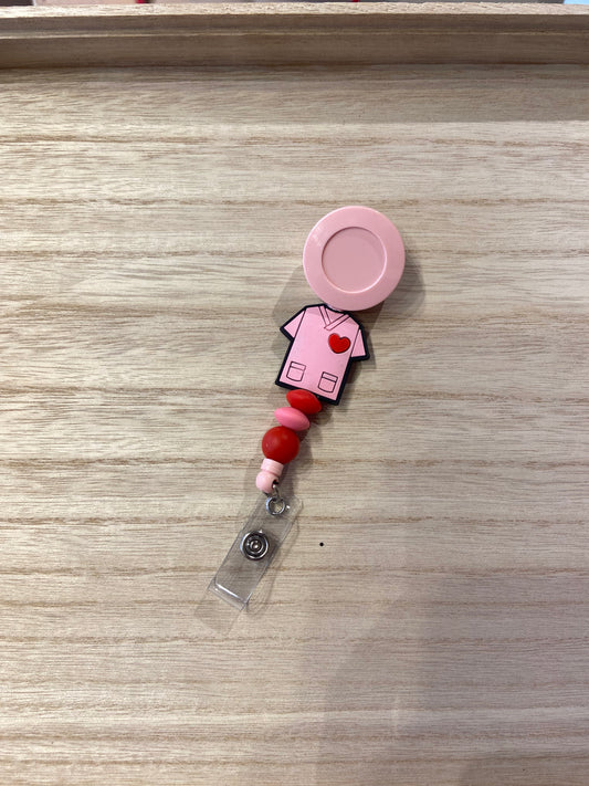 Badgehouder met trekkoord roze schort